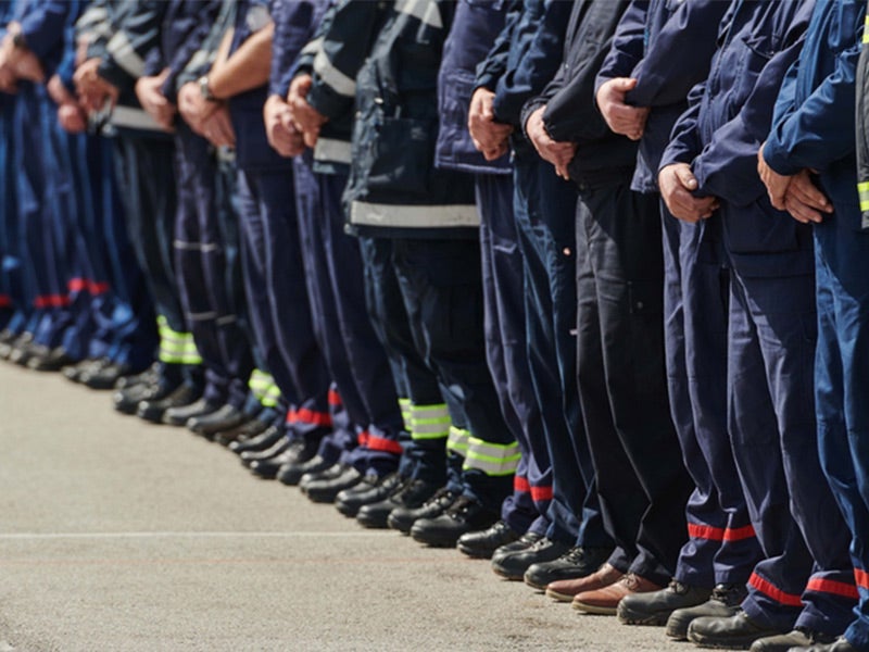 First responder next to emergency vehicle